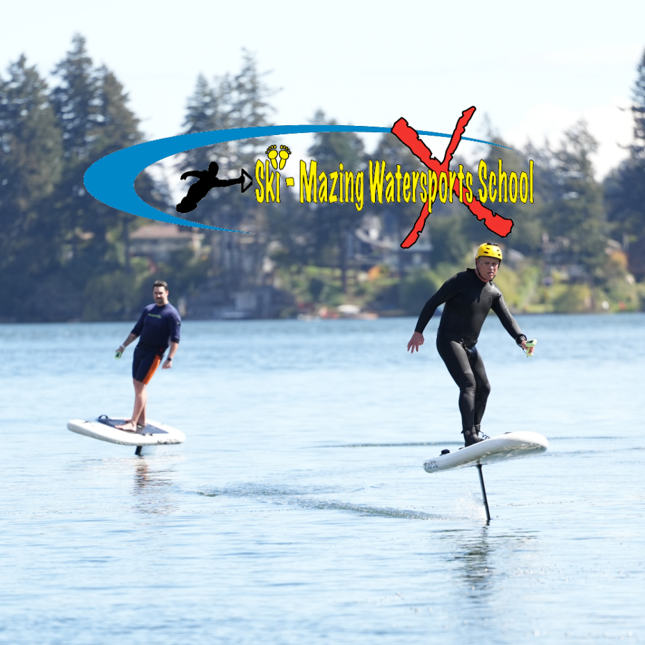 Two people on water skis with a logo for Ski-Mazing Watersports School in the background.